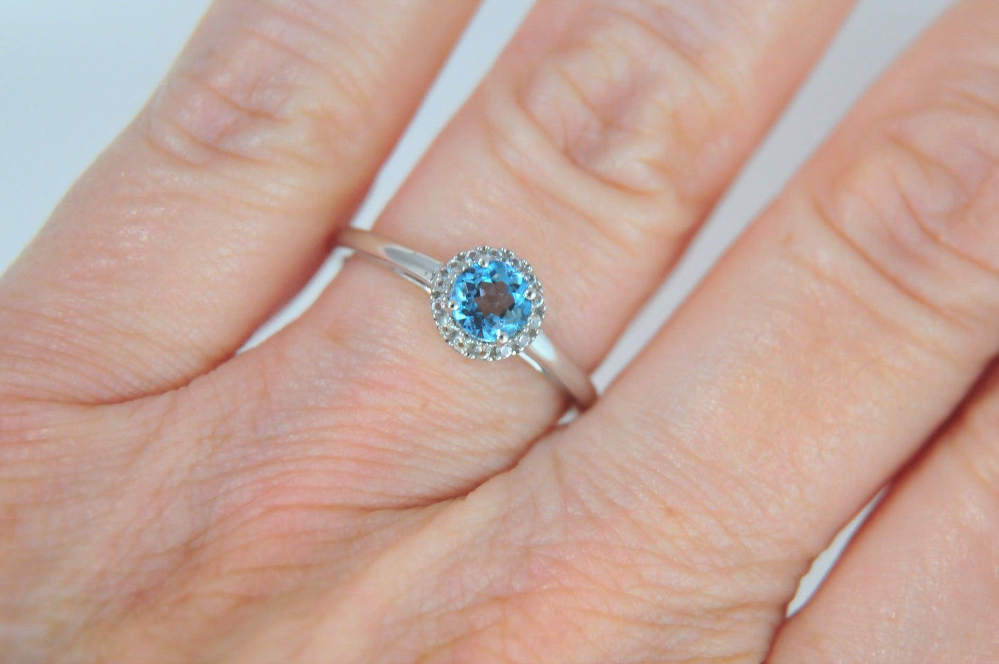 10K White Gold Blue Topaz Ring with CZ Accents Size 8