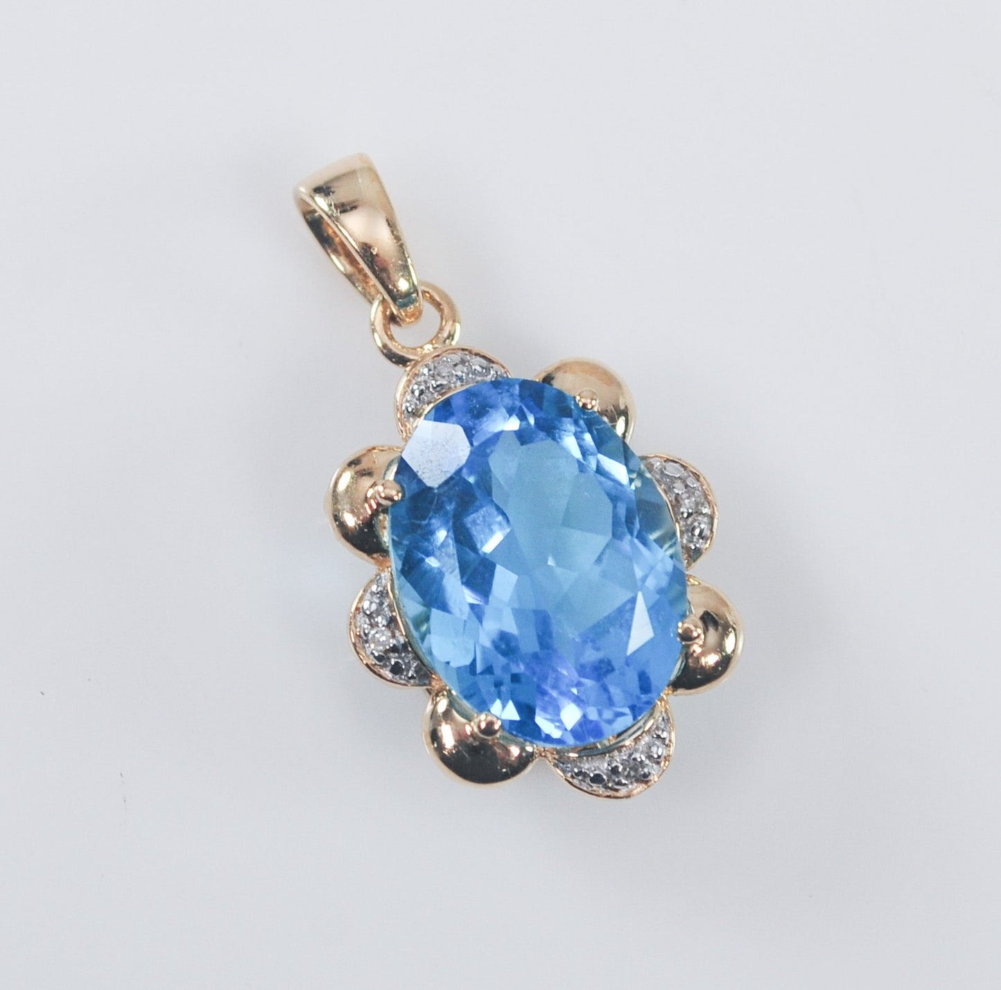 10K Gold Blue Topaz Pendant with Diamond Accents