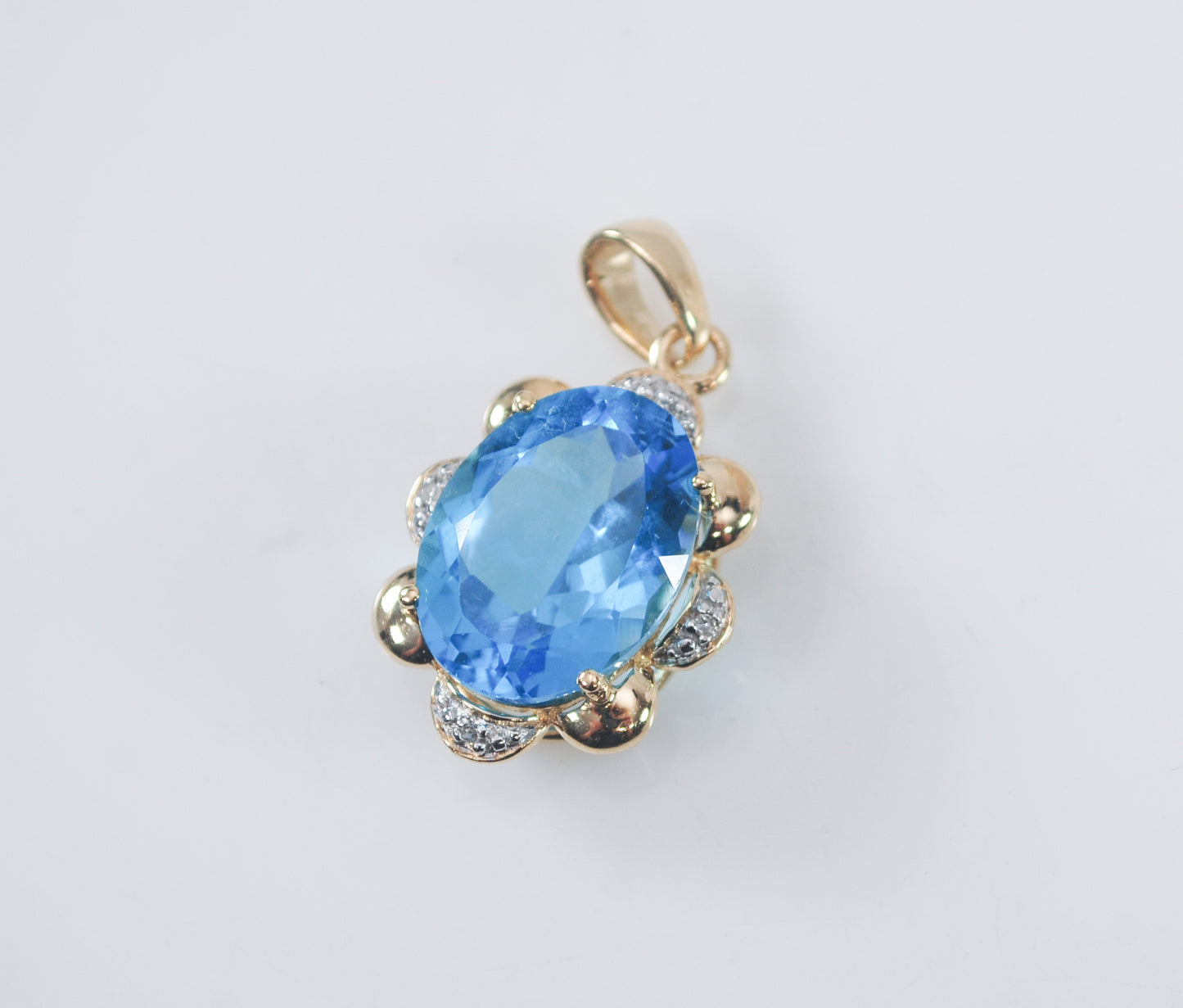 10K Gold Blue Topaz Pendant with Diamond Accents