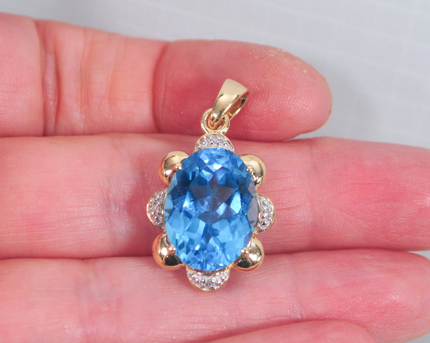 10K Gold Blue Topaz Pendant with Diamond Accents