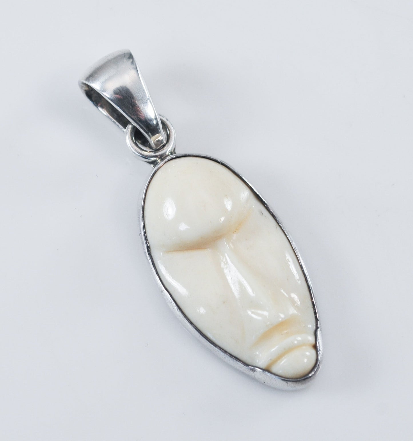 Charles Albert Sterling Silver Carved Bone Face Pendant