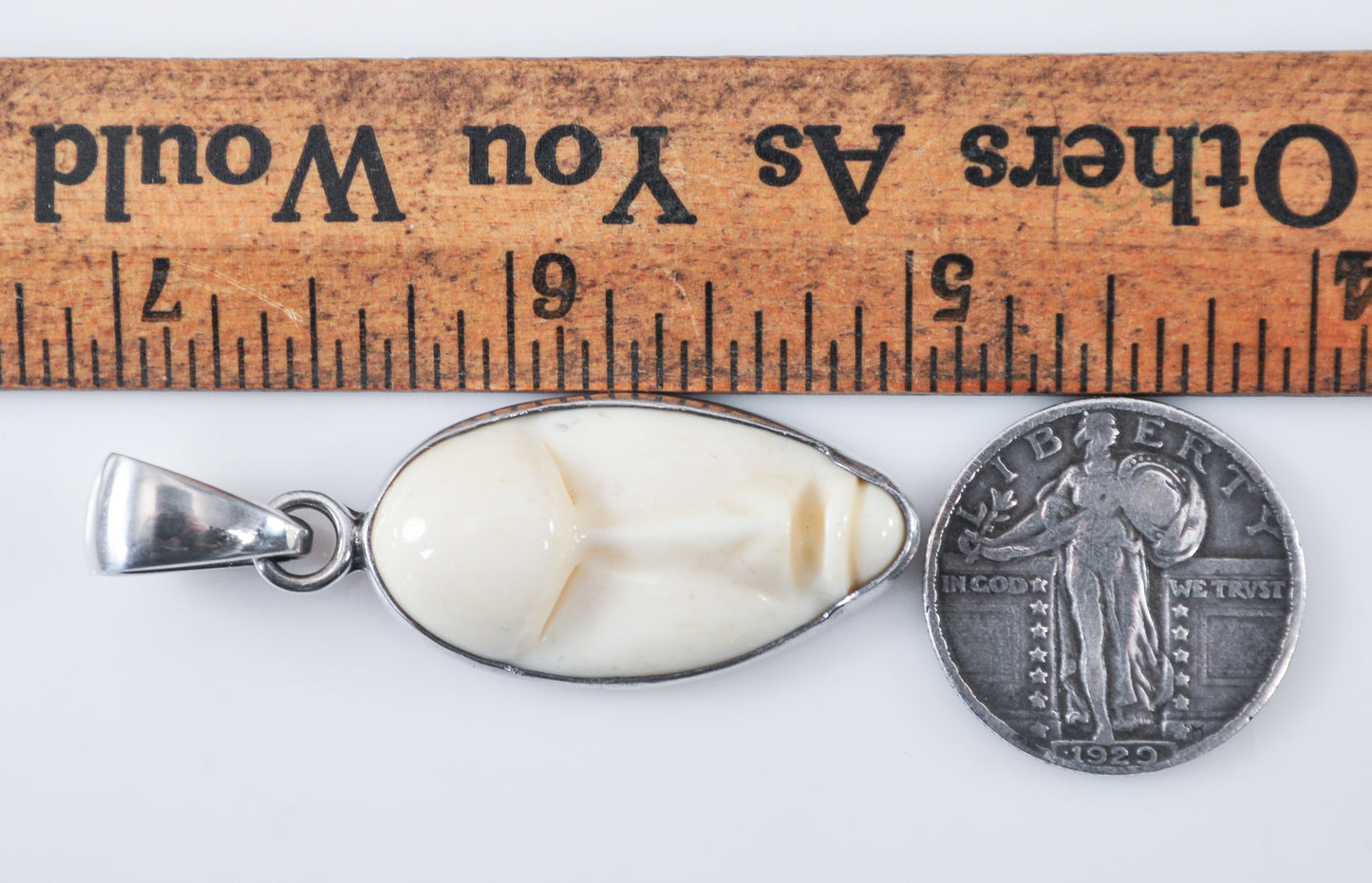 Charles Albert Sterling Silver Carved Bone Face Pendant