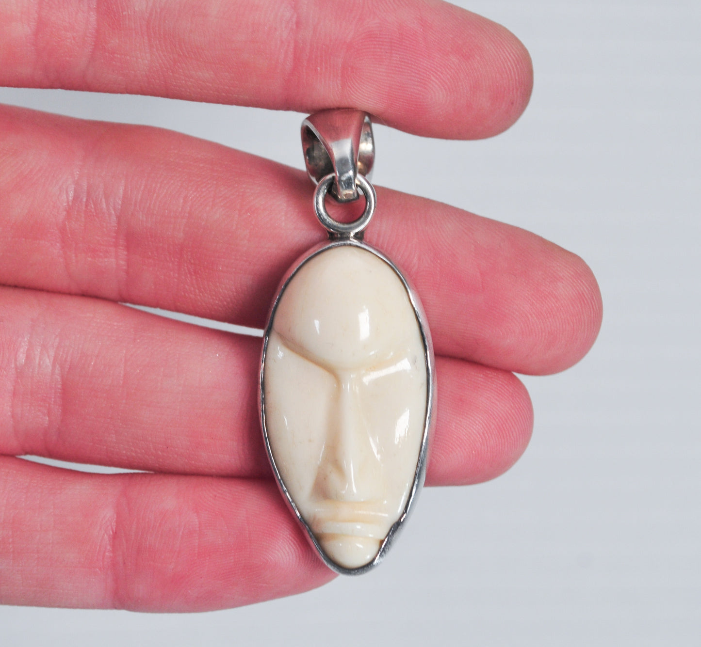 Charles Albert Sterling Silver Carved Bone Face Pendant